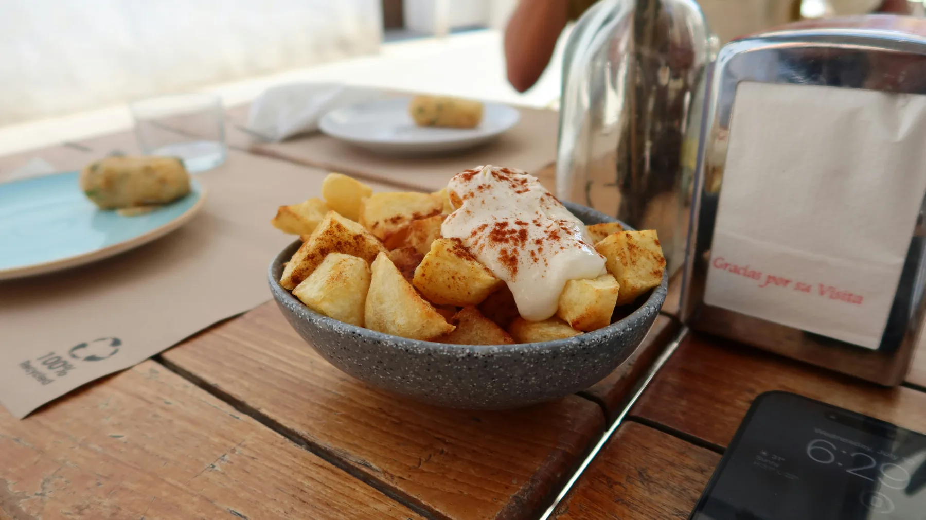 Freshly prepared patatas bravas served at a Mediterranean tapas restaurant